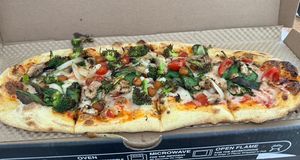 Pizza with vegan cheese and veggies  at IAD - &pizza - CC in Dulles