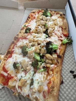 Pizza with regular sauce, vegan cheese, vegan chicken and broccoli  at IAD - &pizza - CC in Dulles