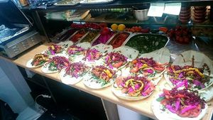 Fresh falafel sandwiches clients even an see how their sandwiches made   at Falafel Bejrut - Nowolipki in Warsaw