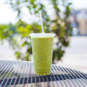 Smoothie with juice #7 (celery, cucumber,kale, romaine, parsley and mint) and vegan coconut & date ice cream. at The Juice in Los Angeles