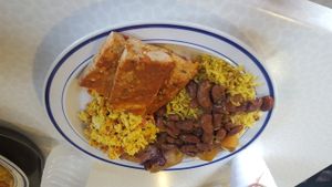 Tofu ";parmigiana";, rice with soy chorizo and beans, tofu scramble, and sweet plantains at Origen in Ponce