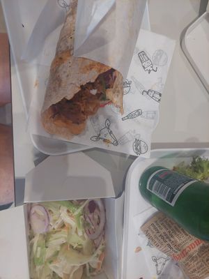 Wrap with a side dish of coleslaw at Krowarzywa in Krakow