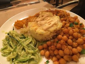 Plato del día... Meal of the day... Baked chickpeas, raw zucchini pesro, millet and vegetable cake, carrot paté... Yummy at Gustu Bilbao in Bilbao