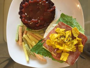 ***TOP 5 
The Impossible Burger  

Impossible burger patty, burger bun, vegan bacon, vegan egg (soy), vegan cheese, housemade burger sauce, lettuce, tomato, ketchup, pickle
relish. at Loving Vegan Market & Cuisine in Winter Park