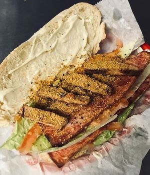 ***TOP 10 
Veg Bacon Chickun Sandwich  

Vegan toasted bread, vegan bacon, vegan chicken, vegan mayo, lettuce, tomato, vegan Parmesan cheese powder. at Loving Vegan Market & Cuisine in Winter Park