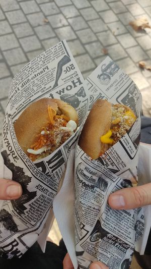 Hotdogs, one with carrot pickle and Chinese cabbage salad, the other with pear salad and beetroot salad at Velo Vege Food Bike in Toulouse