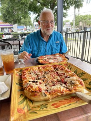 Mine is vegan -his is not. 😃  at Blue Highway Pizza in Ocala