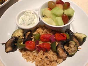 Veggie Kabobs over rice plus side of fresh fruit at Zoës Kitchen in Bluffton