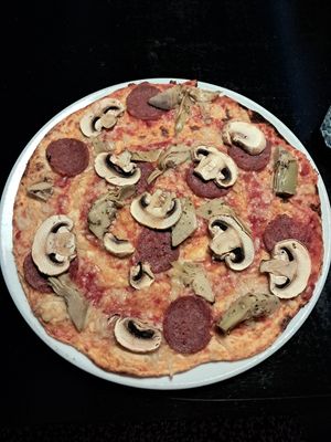 Vegan cheese and pepperoni, artichokes and mushroomd at Pizzeria Roihu in Joensuu