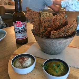 Homemade crackers with cilantro and tahini dip at Bijzonder in Maastricht