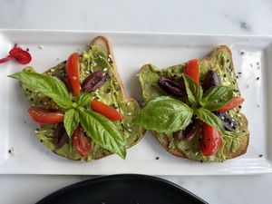 Tomato basil avocado toast. Tasty and beautiful too   at Pure Food and Juice in Tulsa