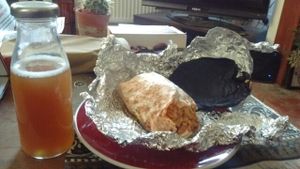 spicy bean burrito and tea  at Bia Kitchen Vegan Diner - Food Stall in Norwich
