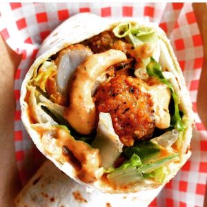 Po-Boy wrap- Southern fried baby button mushrooms with Remoulade Sauce and Romaine Lettuce. at Bia Kitchen Vegan Diner - Food Stall in Norwich