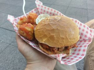 BBQ pulled jackfruit burger with beer-battered cauliflower bites in hot sauce at Bia Kitchen Vegan Diner - Food Stall in Norwich