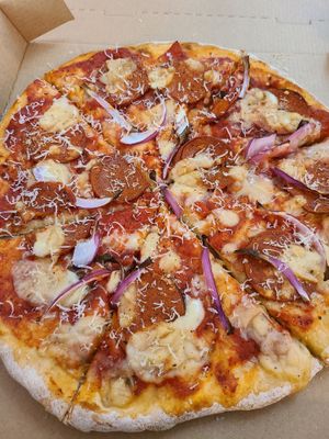 Pepperoni pizza  at Half-Peach Bakery & Cafe in Louisville