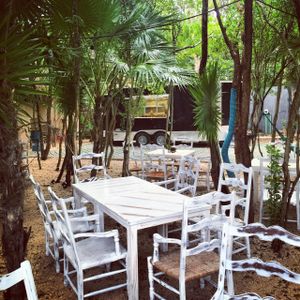 Table area in Jungle with Truck in Background at Charly's Vegan Tacos - Food Truck in Tulum