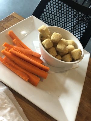 Tofu Buffalo bites: tofu flash fried, tossed with Buffalo sauce, serve with ranch and veggies sticks (gf)  at Root in Lancaster