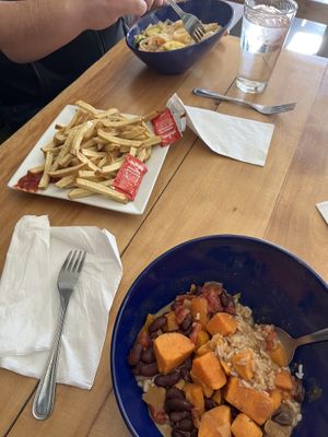 Pad thai with big zucchini pieces, fresh fries (not from a bag), and African sweet potato rice bowl   at Root in Lancaster