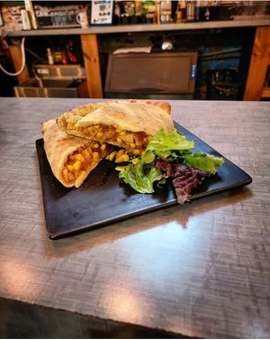 Seafood Mushroom, Sausage, Potato, and Corn Calzone at Root in Lancaster