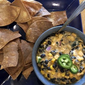Enchilada Dip: Zucchini, corn, black beans and onions in a creamy dip served with tortilla chips at Root in Lancaster