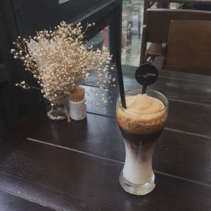 Oat milk coffee shaking glass in a peace corner. So amazing drink :) at Homefood - Truc Khe in Hanoi