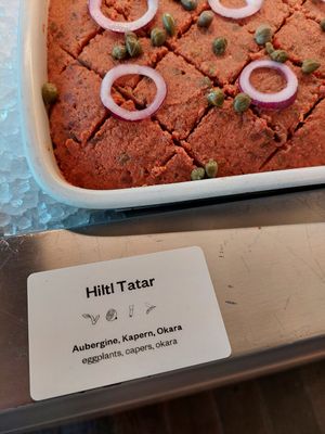 The first symbol indicates a vegan option at Hiltl - Dachterrasse in Zurich