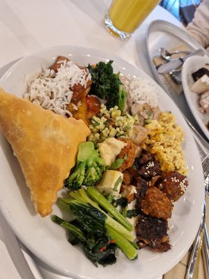 Plate with Samosa, Springrolll, Srambled eggs, veggies, at Hiltl - Dachterrasse in Zurich