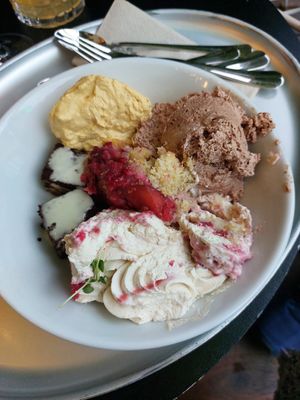 Mango and chocolate mousse, brownies with vanilla sauce, raspberry and peach crumble and raspberry tiramisu at Hiltl - Dachterrasse in Zurich