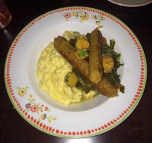 Vegan Sausage & Leek Grits with smoky Collard Greens at Chive Kitchen in Farmington