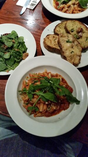 My vegan dinner tonight.....Garlic Bread with Mozz; Roast vege side salad; Chilli & Garlic tomato Penne. at Farelli's Trattoria in Queenstown
