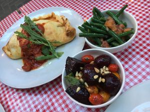 Calzone (left) with side dishes on beets and green beans at Farelli's Trattoria in Queenstown