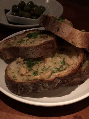 Garlic bread and Sicilian olives at Farelli's Trattoria in Queenstown