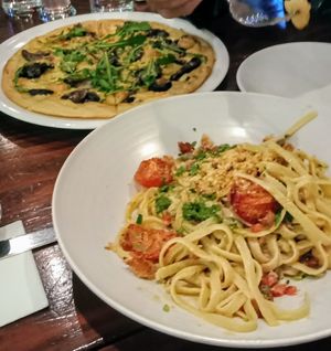 Absolutely delicious! Vegan creamy fettuccine and mushroom pizza! at Farelli's Trattoria in Queenstown