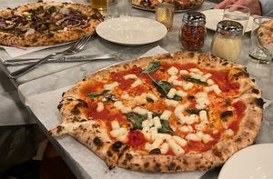 Margherita pizza with cashew cheese, veggie pizza with cashew cheese on left!  at Pizza Barbone in Hyannis