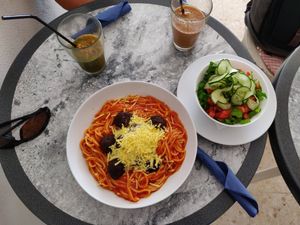 Spaghetti with lentil "meat balls" and vegan cheese. at Nigella Bistro in Benalmadena