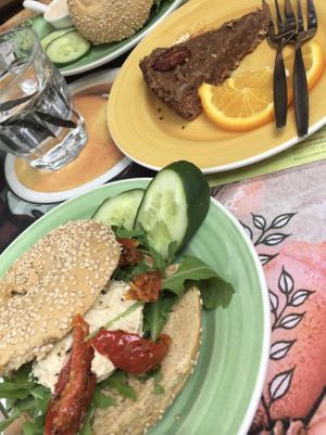 bagel with hummus, dried tomatoes and rocket & vegan pecan pie  at Bagels & Beans in Enschede