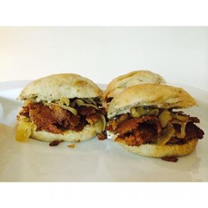 the signature hail seitan sandwich, crispy seita in, carmalized onions, homemade vegan mayo, cashew cream sauce. A NYC style handheld. at Green Bar in Makati