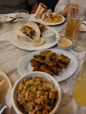 smashed potatoes, cheesy crackling burrito, tofish tacos and chickpea side salad at Green Bar in Makati