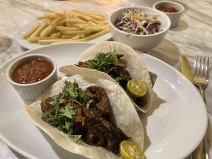 Seitan taco with side of fries and coleslaw  at Green Bar in Makati