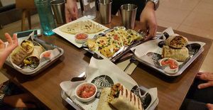 Cheesy mac burrito's and vegan nachos!!!! at Green Bar in Makati