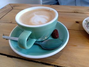 Coffee with spiced pecan at By Lima in Haarlem