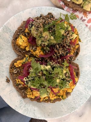 No egg egg salad sandwich with avocado and pickled onions  at By Lima in Haarlem