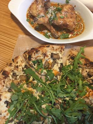 Pizza and fries artichoke hearts at The Butcher's Daughter in Venice