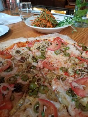 Artichoke olive vegan pizza and veganized pad thai at The Butcher's Daughter in Venice