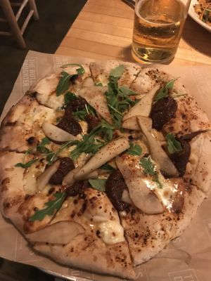Dulce Picante Wood Fired Pizza with  fig jam, spicy red pepper, pear, Gorgonzola, honey arugula.  at The Butcher's Daughter in Venice