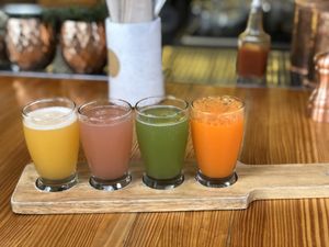 Passion fruit, watermelon, cucumber, and orange/tangerine mimosas  at The Butcher's Daughter in Venice