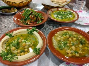Hummus, fatoush, moutabal, mystery dish at Hashem's Son Restaurant in Aqaba