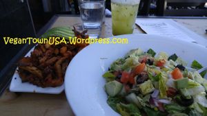 Vegan version salad and soyrizo fries topped with avocado at Crushed in Pacific Beach. at Crushed in San Diego
