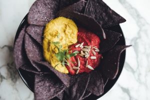 lemon hummus and beetroot dip with GMO-free corn chips at Redemption - Shoreditch in East London