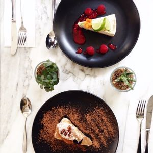 beautiful modern marble tables and amazing afternoon vegan cheesecake  at Redemption - Shoreditch in East London